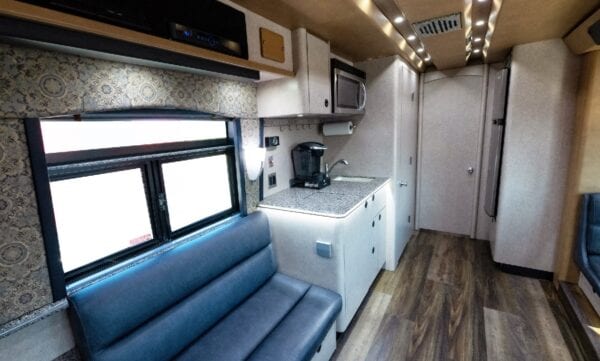 Front lounge in Deja Vu entertainer coach by Village Travel